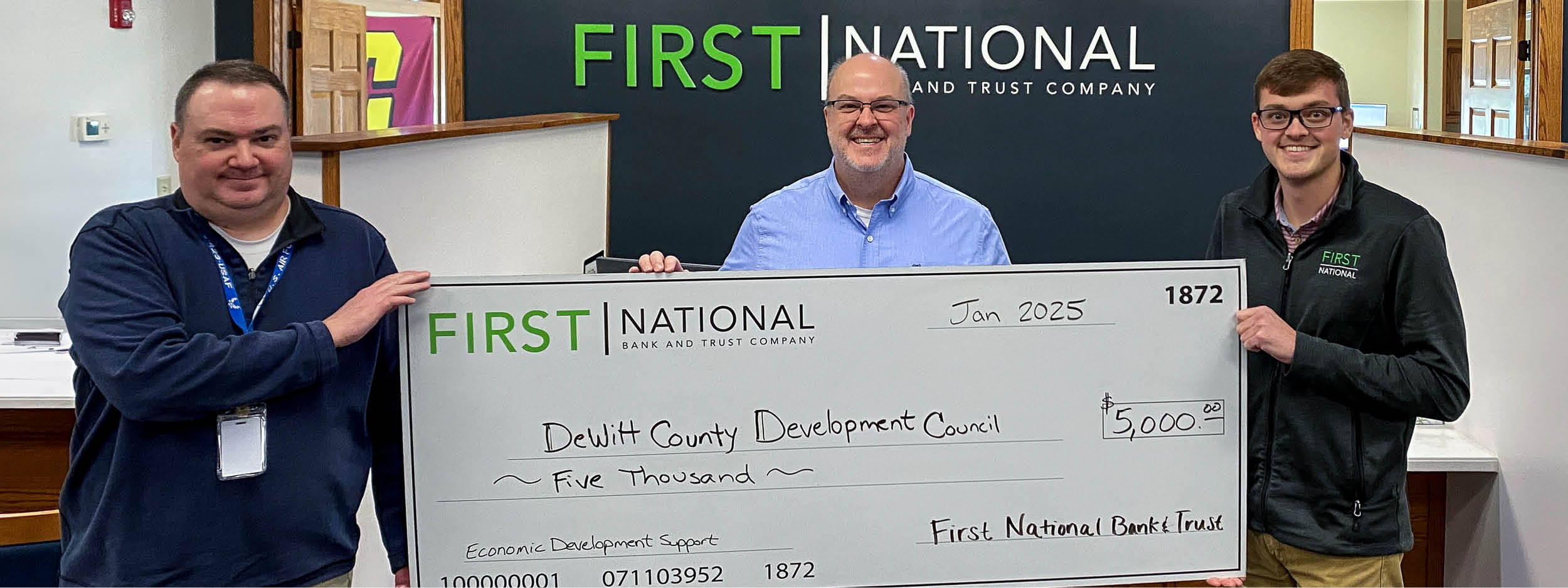 FNBT employees gifts check to DCDC employee